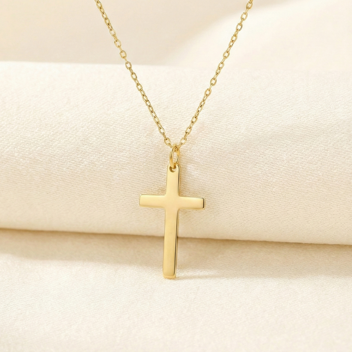 Gold cross necklace. 