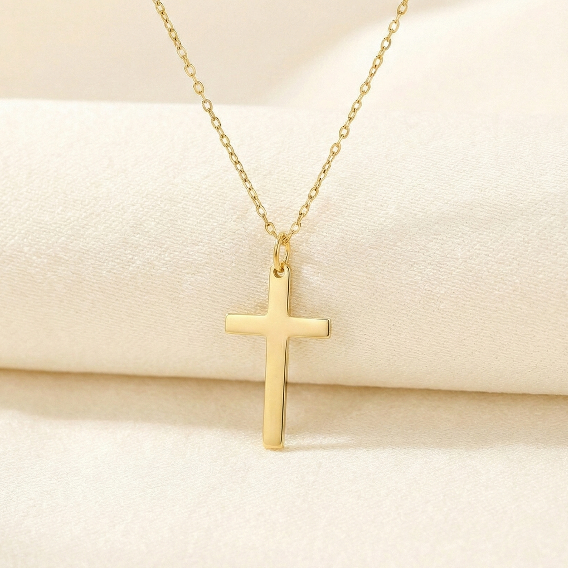 Gold cross necklace. 