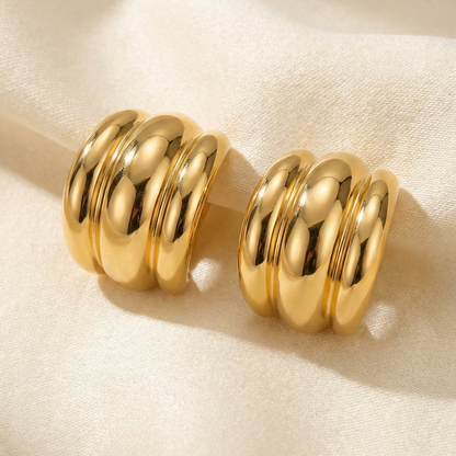 Pair of gold hoop earrings. 