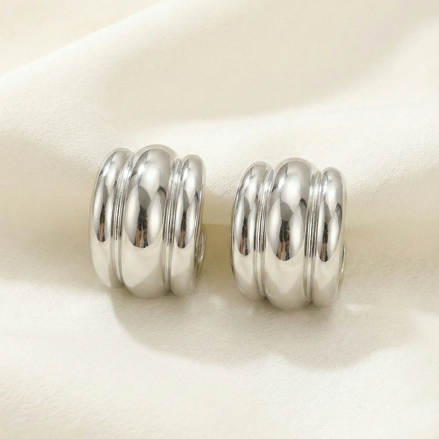 Pair of silver spiral earrings  hoops. 